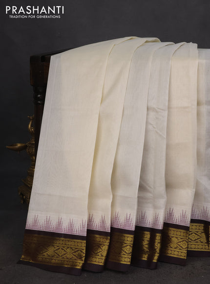 Silk cotton saree off white and coffee brown with plain body and temple design zari woven korvai border