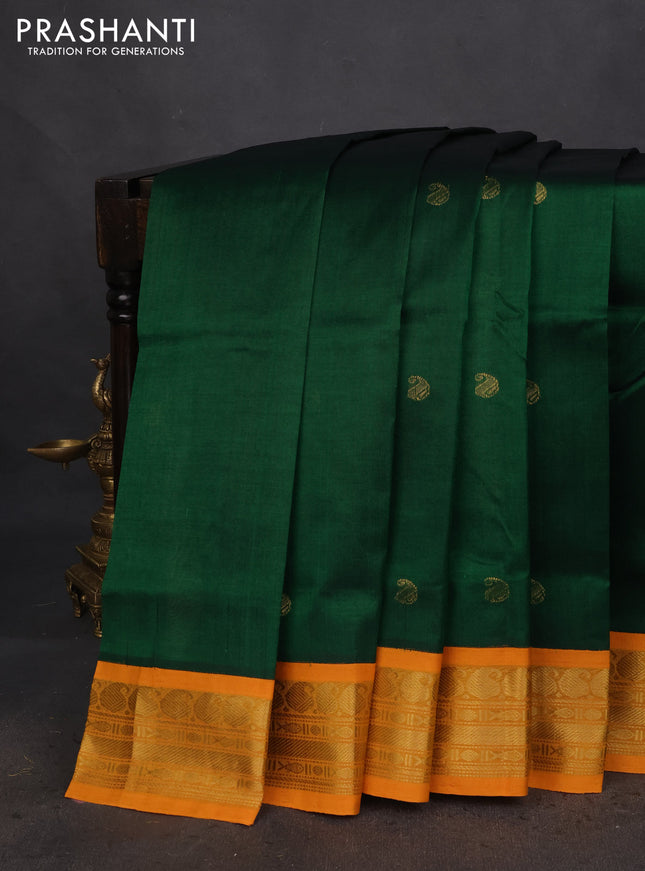Silk cotton saree green and mustard yellow with paisley zari woven buttas and zari woven korvai border