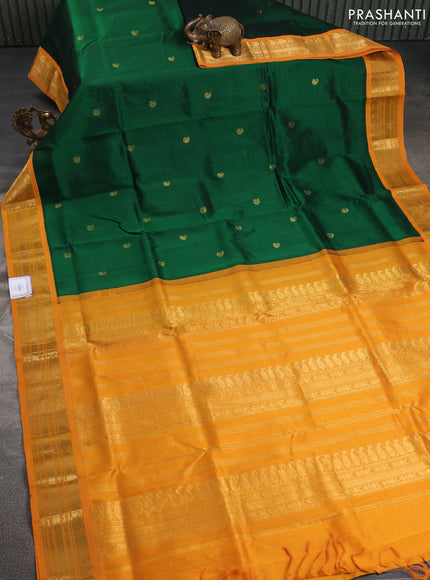 Silk cotton saree green and mustard yellow with paisley zari woven buttas and zari woven korvai border