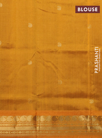 Silk cotton saree green and mustard yellow with paisley zari woven buttas and zari woven korvai border