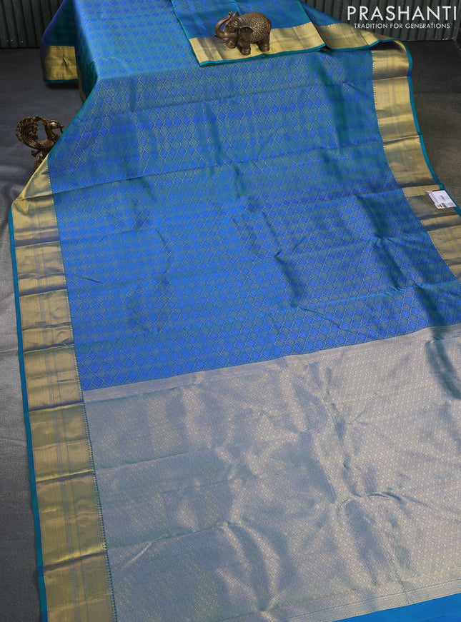Pure kanchipuram silk saree dual shade of teal green with allover self emboss & zari weaves and rich zari woven border