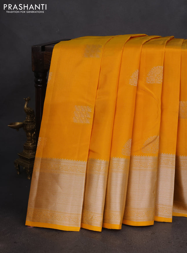 Pure kanchipuram silk saree yellow with self emboss & silver zari buttas and silver zari woven border
