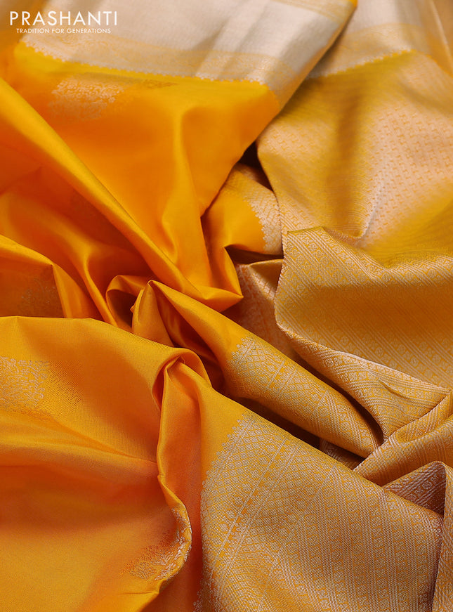 Pure kanchipuram silk saree yellow with self emboss & silver zari buttas and silver zari woven border