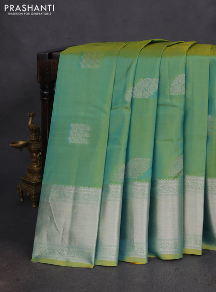 Pure kanchipuram silk saree dual shade of teal bluish green with self emboss & silver zari buttas and silver zari woven border