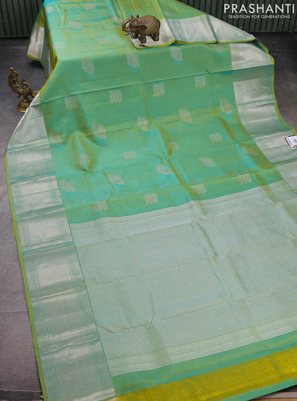Pure kanchipuram silk saree dual shade of teal bluish green with self emboss & silver zari buttas and silver zari woven border