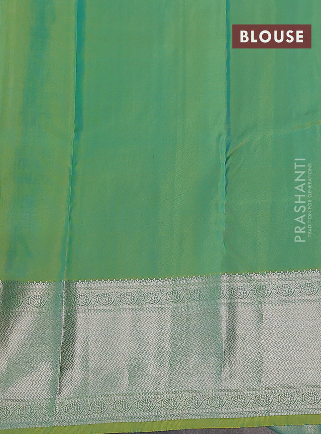 Pure kanchipuram silk saree dual shade of teal bluish green with self emboss & silver zari buttas and silver zari woven border