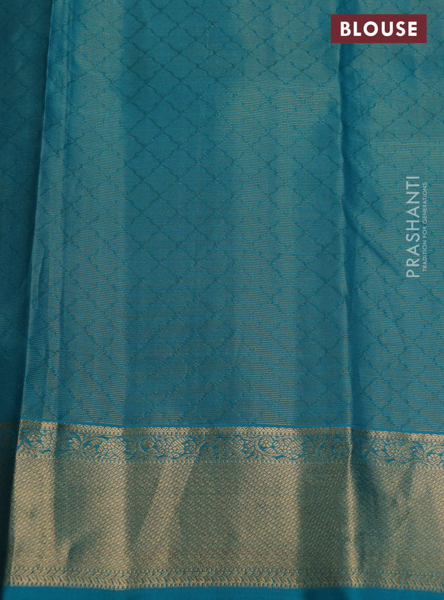 Pure kanchipuram silk saree black and teal blue with allover self emboss & zari weaves and rich zari woven border