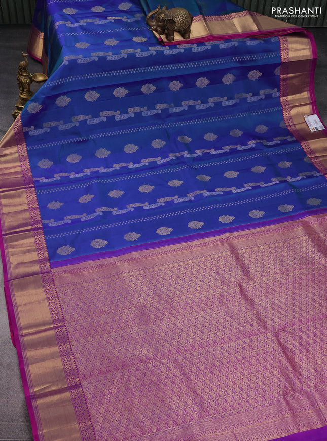 Pure kanchipuram silk saree dual shade of bluish green and purple with silver & gold zari woven buttas and rich zari woven border