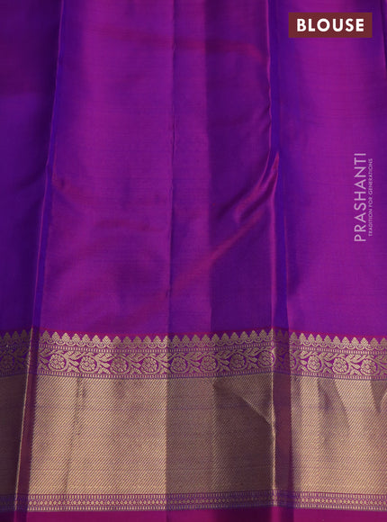 Pure kanchipuram silk saree dual shade of bluish green and purple with silver & gold zari woven buttas and rich zari woven border