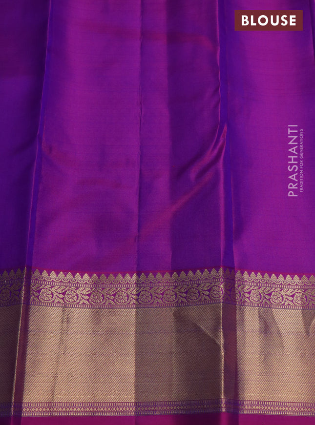 Pure kanchipuram silk saree dual shade of bluish green and purple with silver & gold zari woven buttas and rich zari woven border