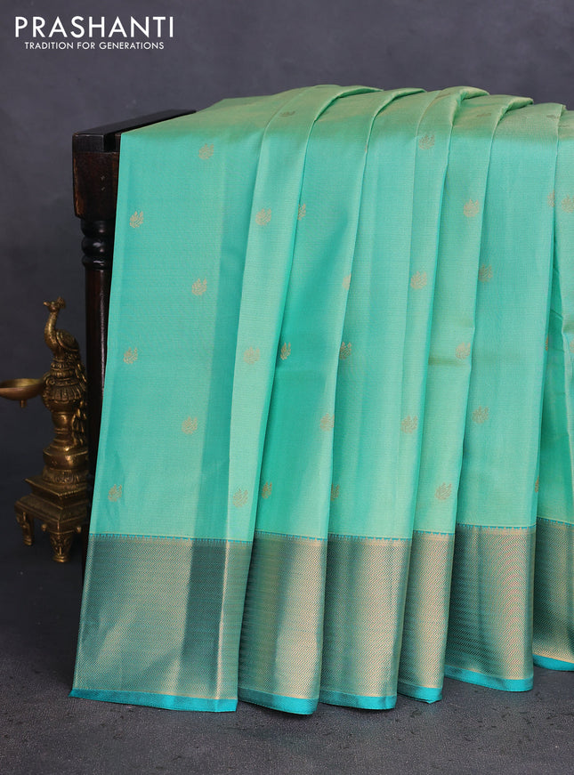 Pure kanchipuram silk saree teal green shade and teal green with allover zari weaves & buttas and zari woven border