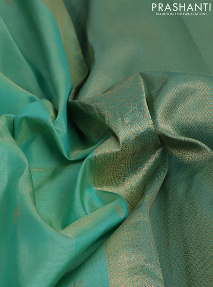 Pure kanchipuram silk saree teal green shade and teal green with allover zari weaves & buttas and zari woven border
