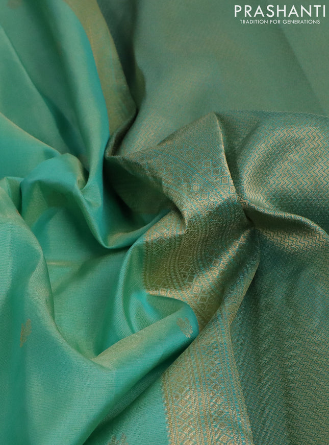 Pure kanchipuram silk saree teal green shade and teal green with allover zari weaves & buttas and zari woven border