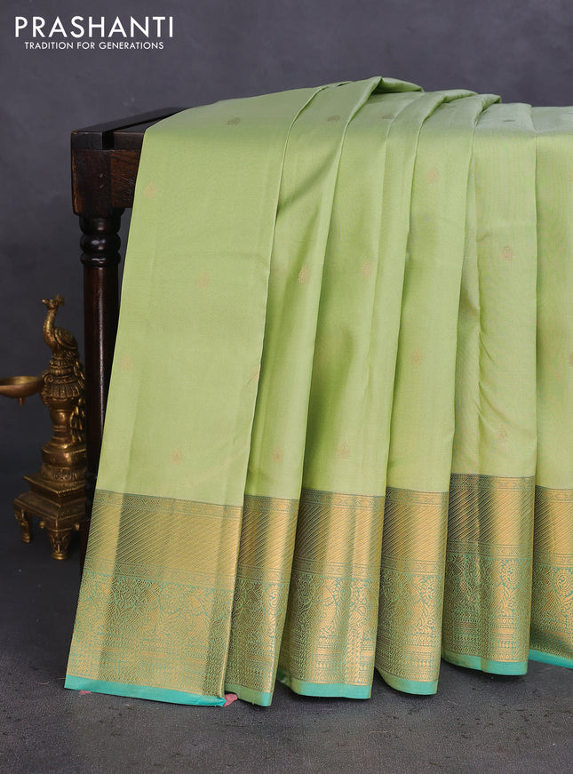 Pure kanchipuram silk saree pista green and teal green with zari woven buttas and rich zari woven border