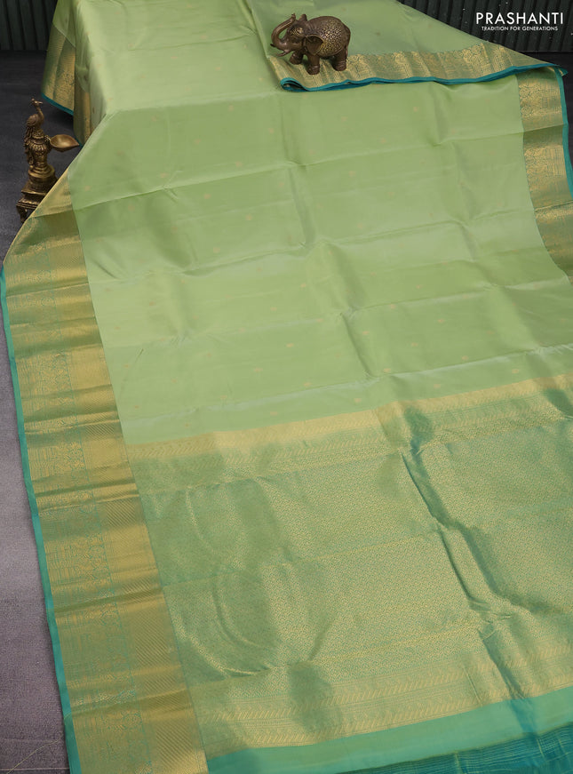 Pure kanchipuram silk saree pista green and teal green with zari woven buttas and rich zari woven border