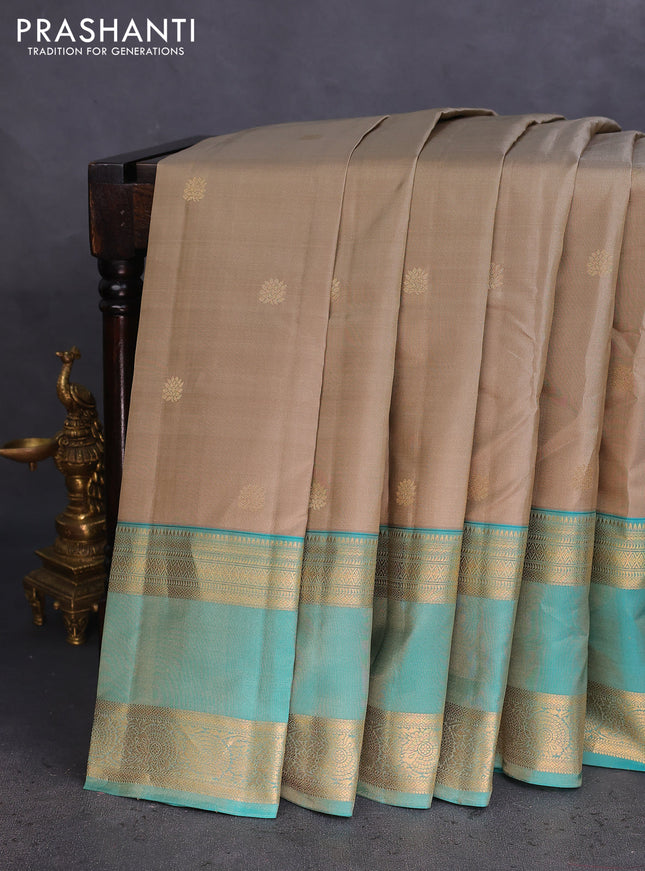 Pure kanchipuram silk saree beige and teal green shade with zari woven buttas and long rettapet zari woven border