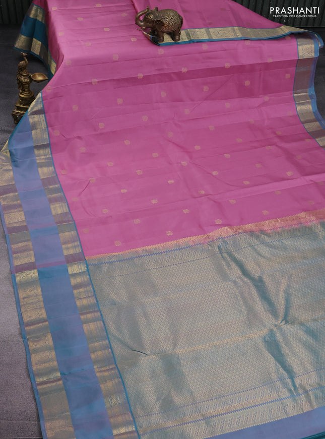 Pure kanchipuram silk saree mauve pink and teal blue shade with zari woven buttas and long rettapet zari woven border