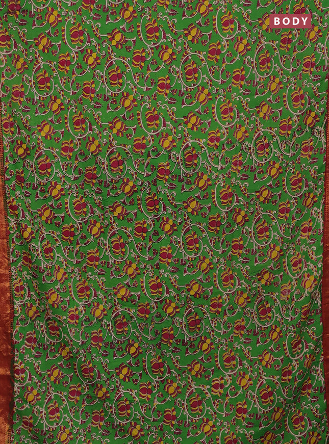Kalamkari semi silk saree green and maroon with allover kalamkari prints and zari woven border