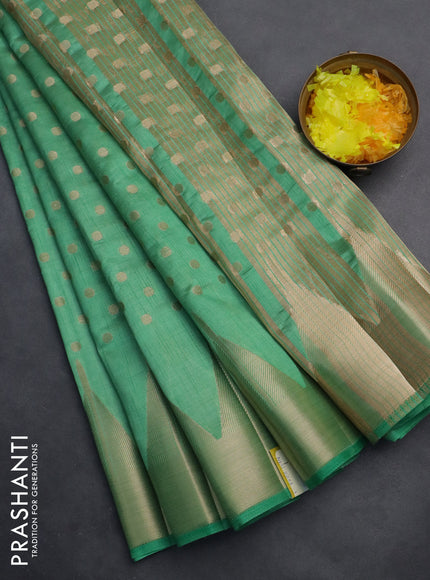Semi raw silk saree pastel green with allover zari woven 1000 buttas and temple design zari woven border