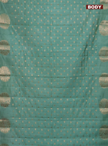 Semi raw silk saree pastel green with allover zari woven floral design 1000 buttas and zari woven butta border