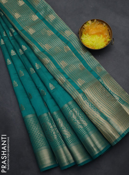Semi raw silk saree teal blue shade with allover zari woven 1000 buttas and long zari woven border