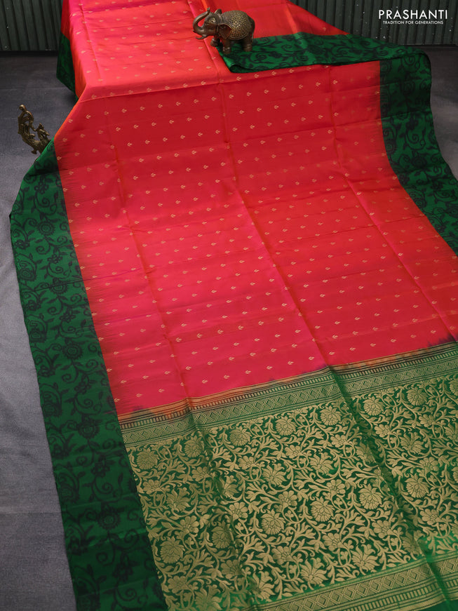 Ikat soft silk saree dual shade of pinkish orange and green with allover zari woven buttas and ikat style border