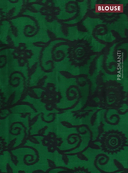 Ikat soft silk saree dual shade of pinkish orange and green with allover zari woven buttas and ikat style border