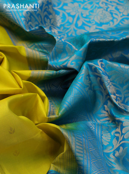 Ikat soft silk saree lime yellow and dual shade of teal blue with allover zari woven buttas and ikat style border