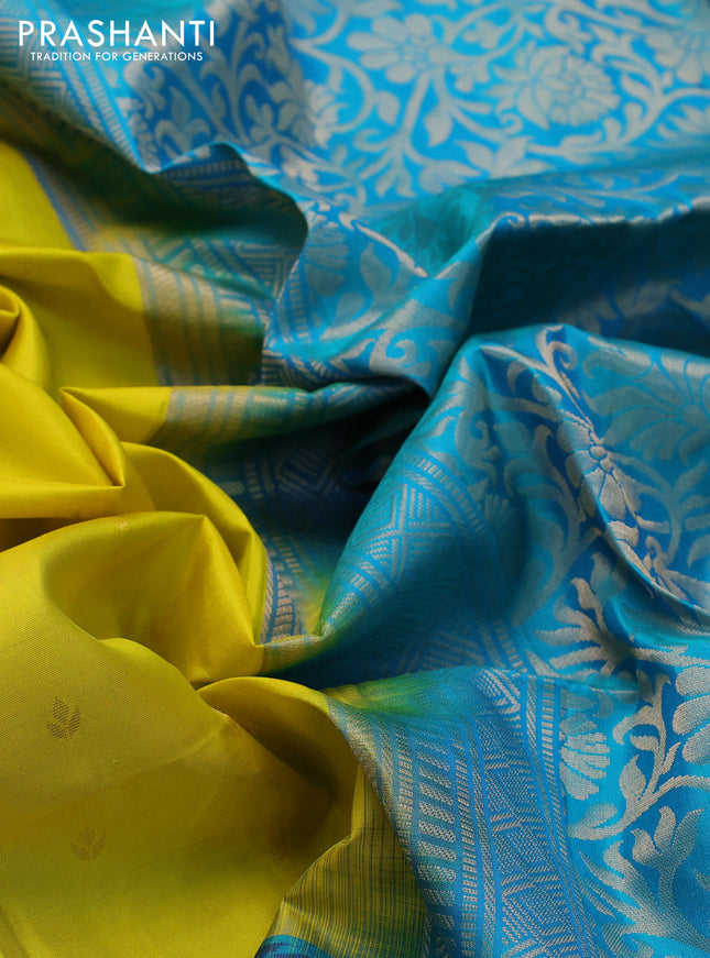 Ikat soft silk saree lime yellow and dual shade of teal blue with allover zari woven buttas and ikat style border