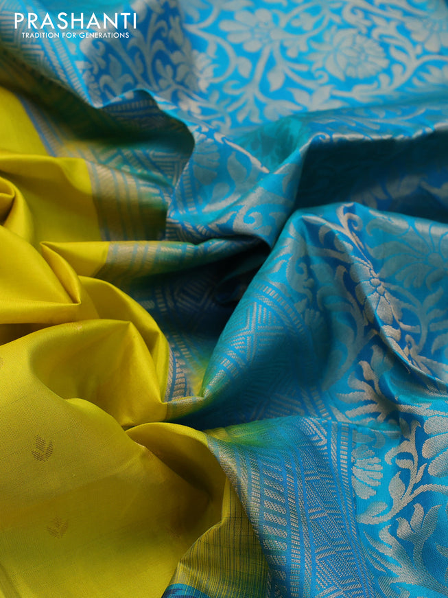 Ikat soft silk saree lime yellow and dual shade of teal blue with allover zari woven buttas and ikat style border