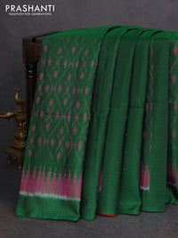 Ikat soft silk saree dark green and red with allover ikat weaves & zari buttas in borderless style