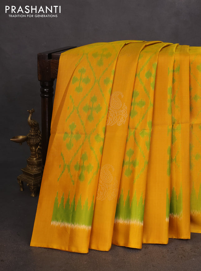Ikat soft silk saree mustard yellow and dark green with allover ikat weaves & zari buttas in borderless style