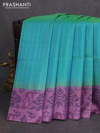 Ikat soft silk saree dual shade of teal bluish green and pastel purple shade with allover zari weaves and ikat style border