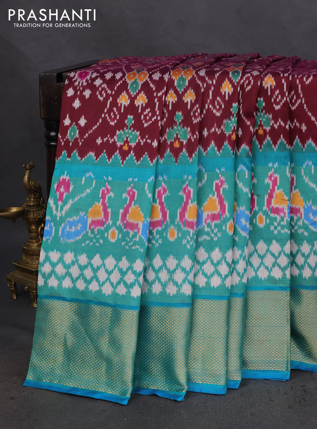 Pochampally silk saree deep wine and teal blue with allover ikat prints and long zari woven border