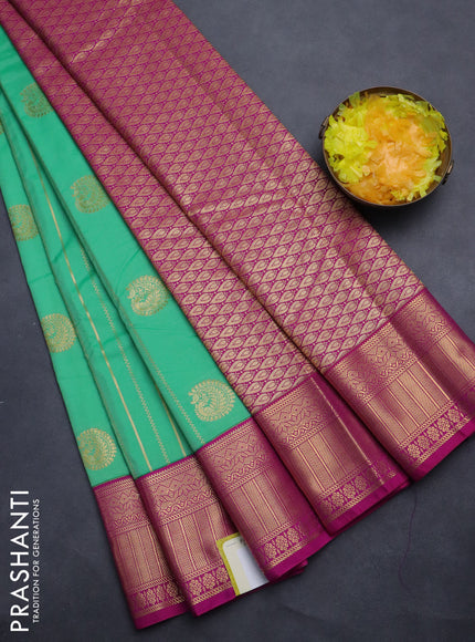 Semi kanchipuram silk saree light green and pink with allover zari weaves & buttas and zari woven korvai border