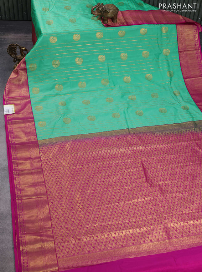 Semi kanchipuram silk saree light green and pink with allover zari weaves & buttas and zari woven korvai border