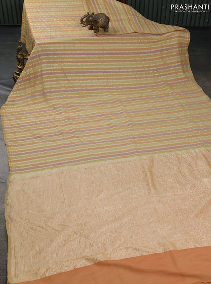 Munga silk saree pale yellow and multi colour with allover zari woven stripes pattern in borderless style