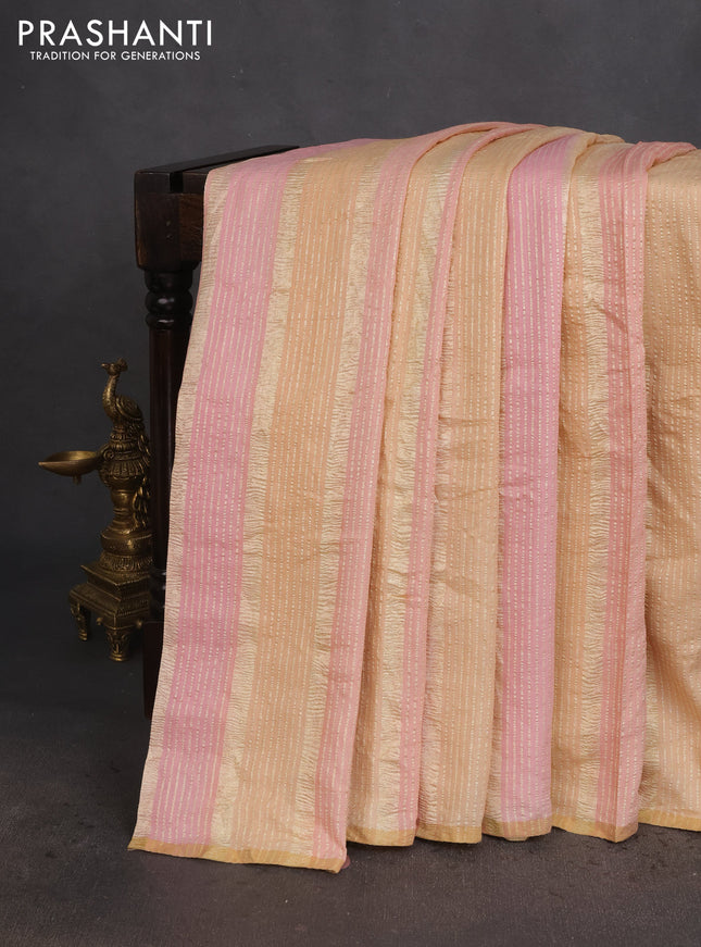 Munga silk saree pastel pink and sandal with allover zari woven stripes pattern in borderless style