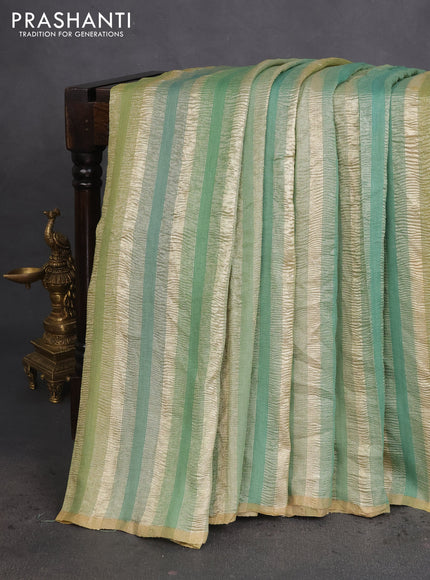 Munga silk saree green shade with allover zari woven stripes pattern in borderless style
