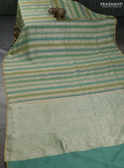 Munga silk saree green shade with allover zari woven stripes pattern in borderless style