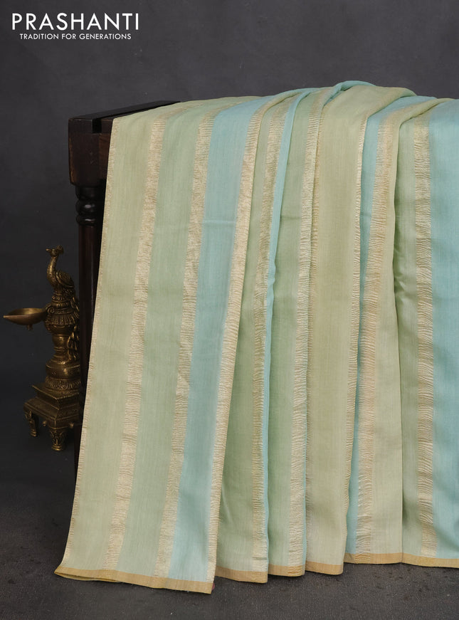Munga silk saree pastel green and pastel blue with allover zari woven stripes pattern in borderless style