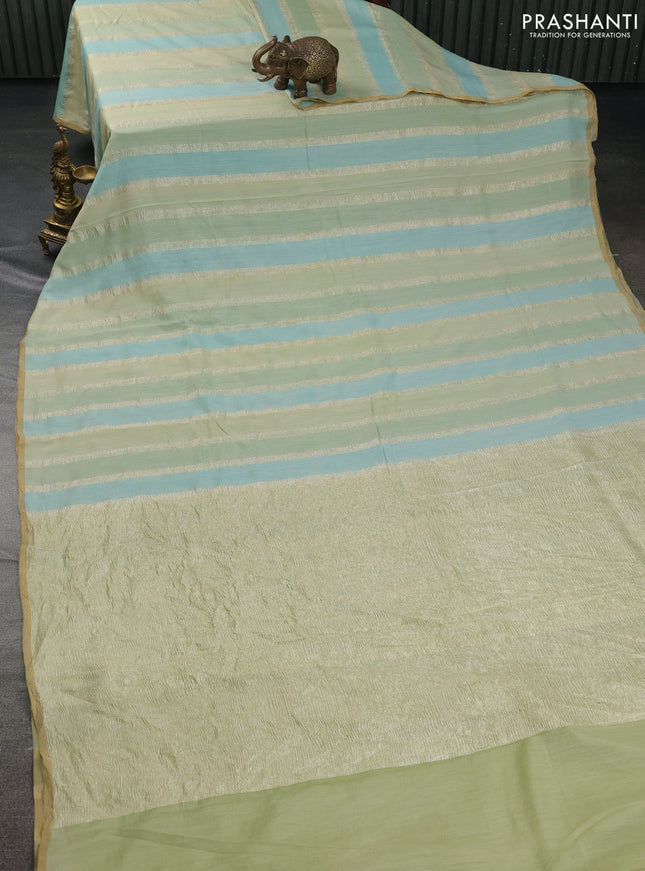 Munga silk saree pastel green and pastel blue with allover zari woven stripes pattern in borderless style