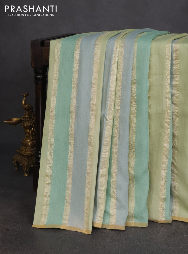 Munga silk saree pastel green and pastel blue with allover zari woven stripes pattern in borderless style