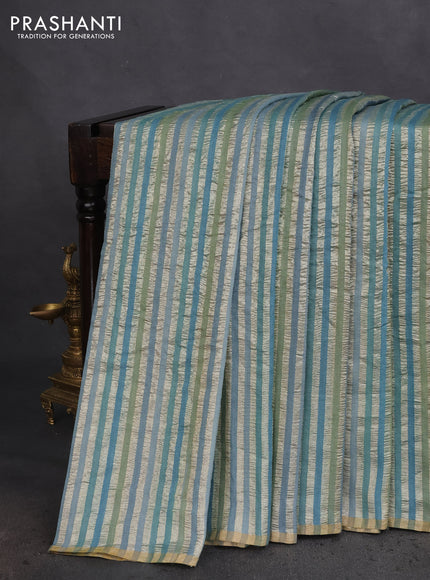 Munga silk saree teal blue with allover zari woven stripes pattern in borderless style