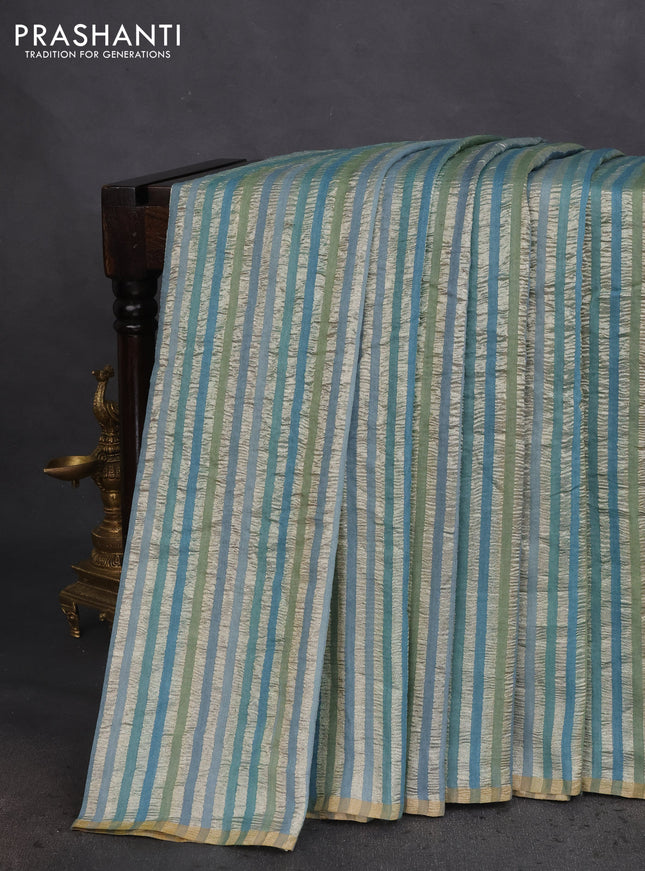 Munga silk saree teal blue with allover zari woven stripes pattern in borderless style