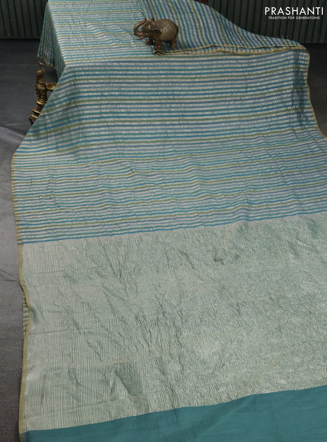 Munga silk saree teal blue with allover zari woven stripes pattern in borderless style