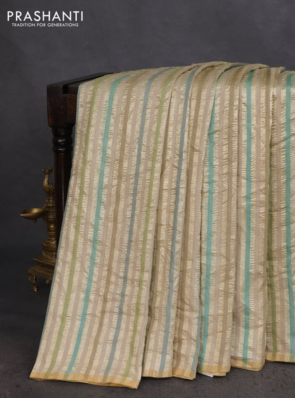 Munga silk saree beige and multi colour with allover zari woven stripes pattern in borderless style