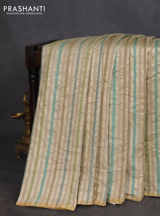 Munga silk saree beige and multi colour with allover zari woven stripes pattern in borderless style