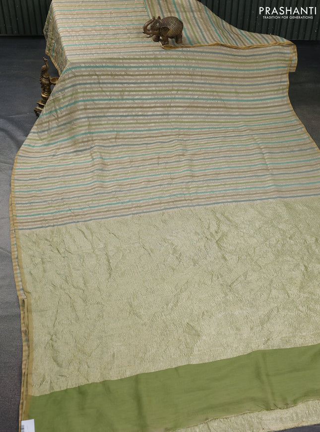 Munga silk saree beige and multi colour with allover zari woven stripes pattern in borderless style