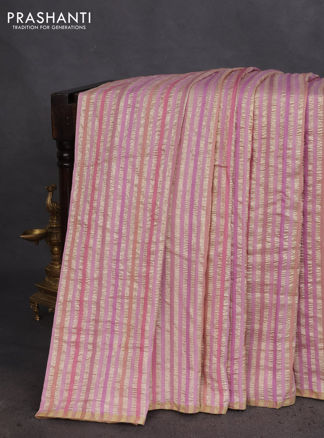 Munga silk saree pastel pink with allover zari woven stripes pattern in borderless style